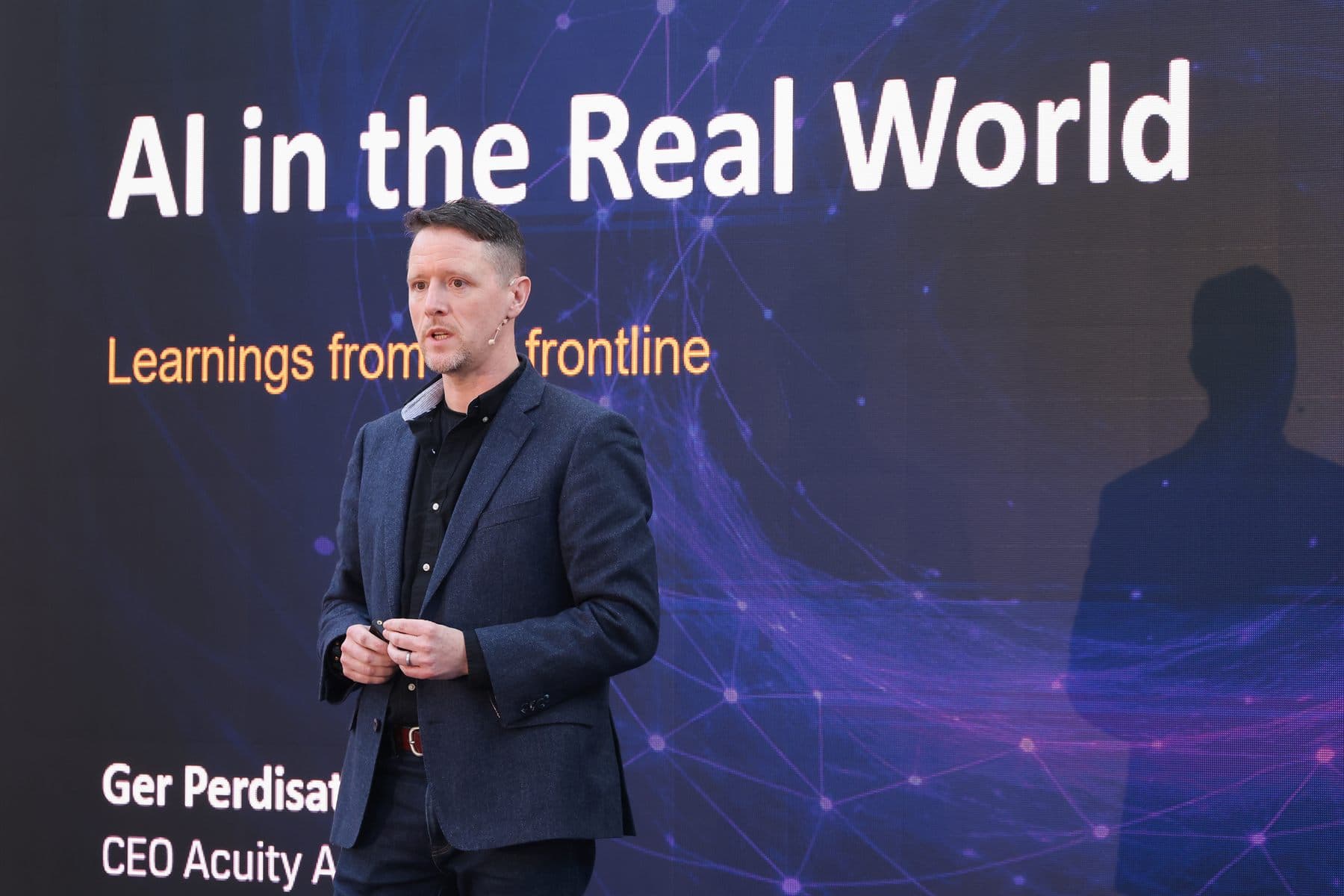 Ger Perdisatt presenting a keynote titled AI in the Real World: Learnings from the frontline.